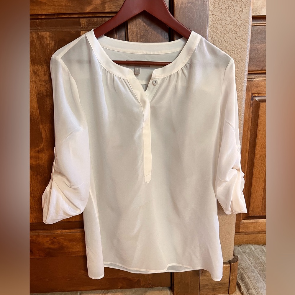 Banana republic size small, 100% silk white shirt. Used one time.